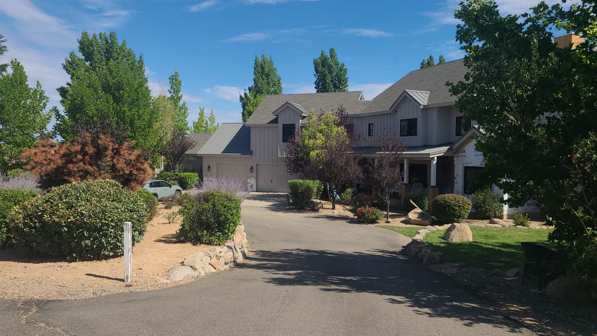 front yard landscape and driveway maintenance by Zebrascapes