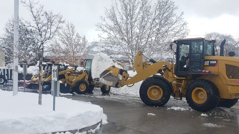 Snow plows removing snow