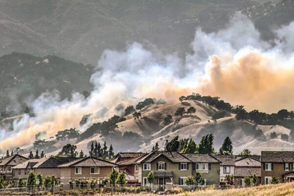smoke from a wildfire overshadows an AZ neighborhood