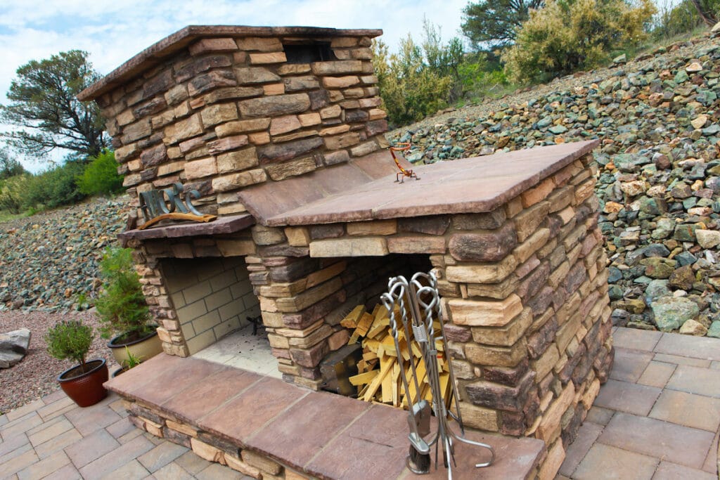 landscape installation zebrascapes: outdoor fireplace and stone wall/barrier