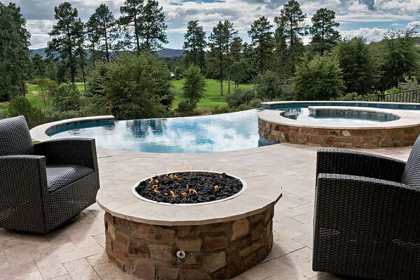 Zebrascapes custom pool design with Infinity edge, also featuring a fire pit and custom hardscape