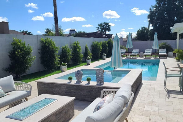 Zebrascapes modern outdoor residential pool design featuring hardscape and multiple water features