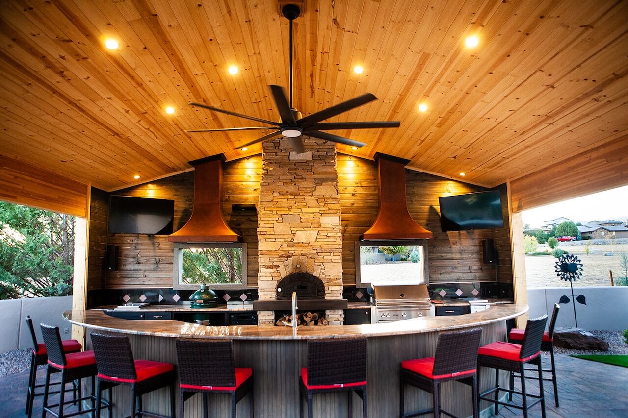 Zebrascapes custom designs and installs living areas like this one, including outdoor kitchens, pizza ovens, and more