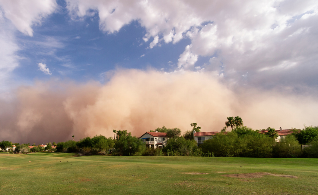 a neighborhood during an approaching dust storm