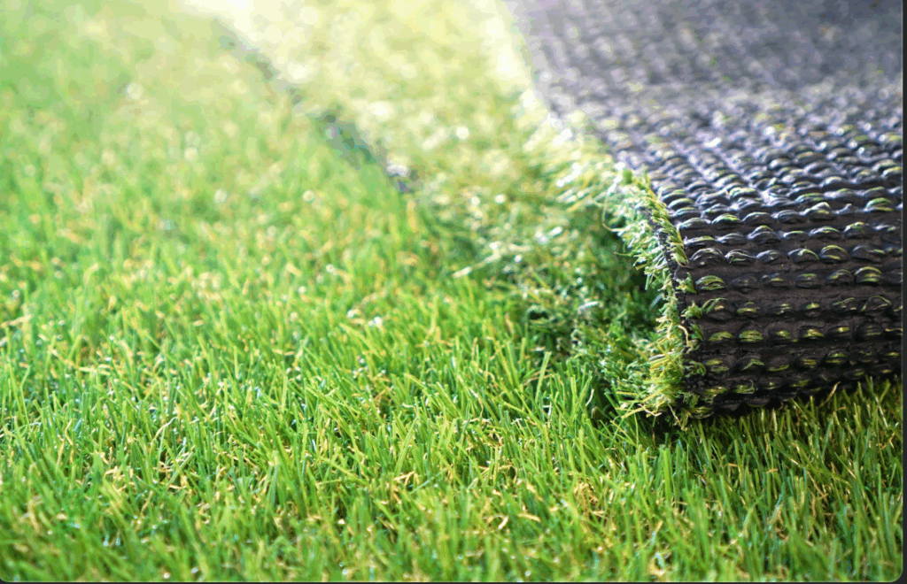 a close up of artificial turf showing the turf and the drainage mat