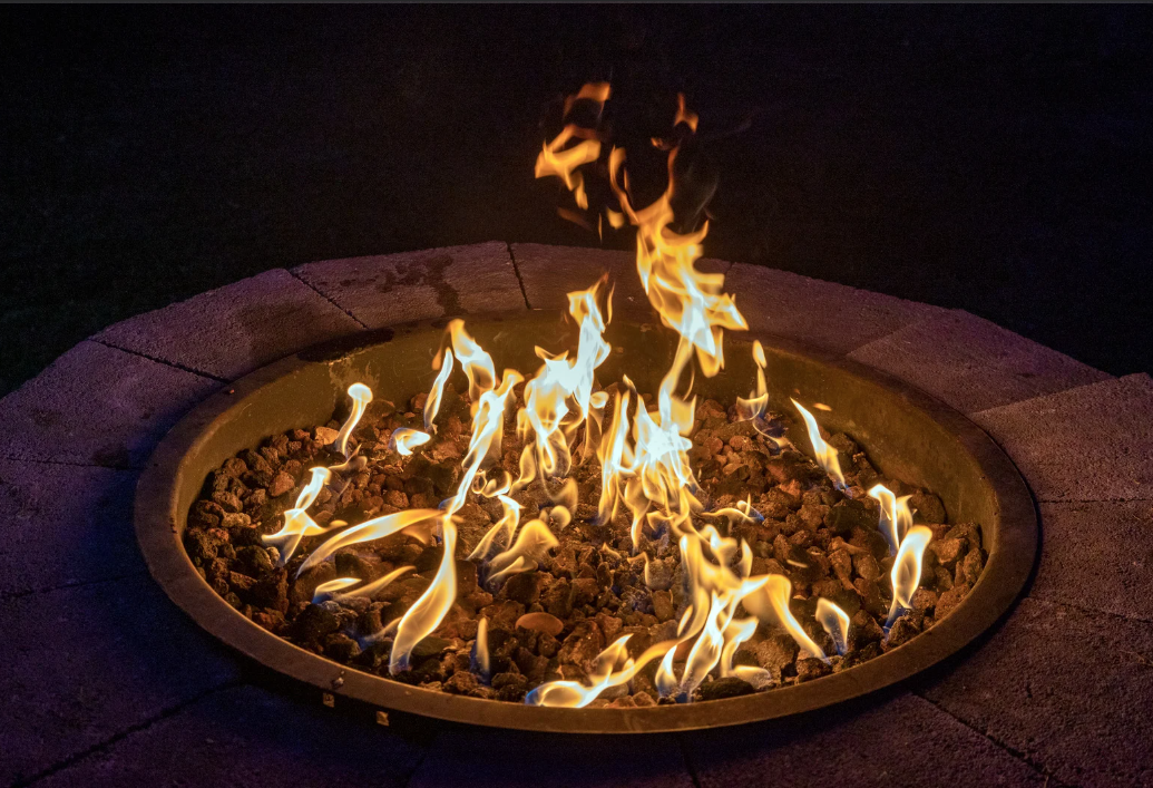 close up of a custom built fire pit in the evening