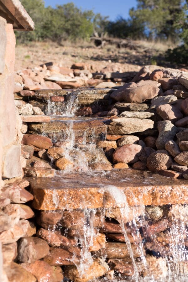 waterfall with rocks zebrascapes landscaping design prescott az