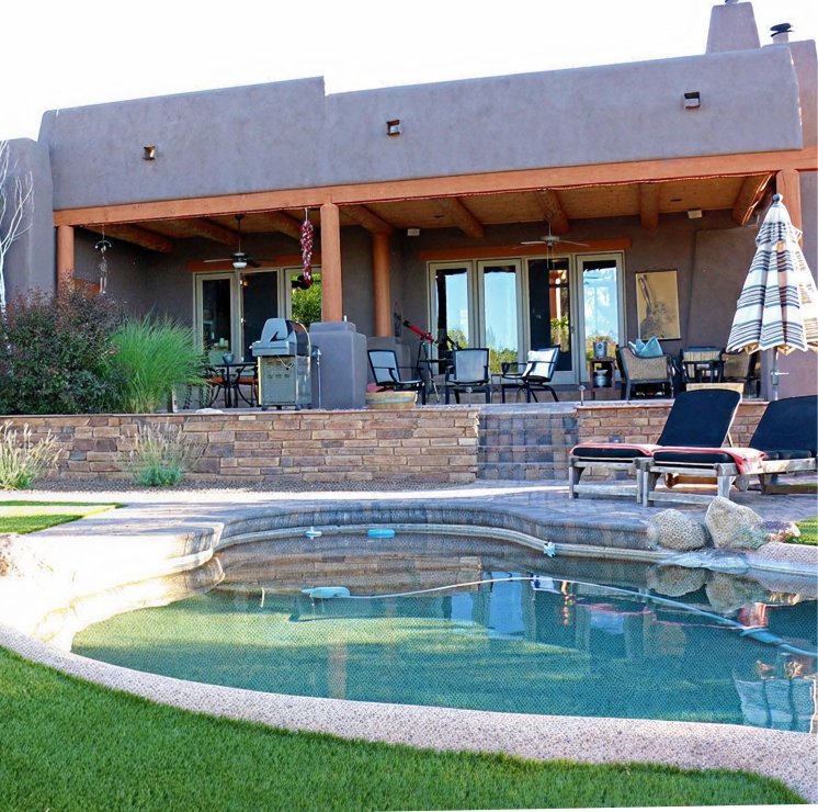 ZebraScapes custom pool design and installation with in-ground swimming pool, hardscapes, native plants, and artificial turf.