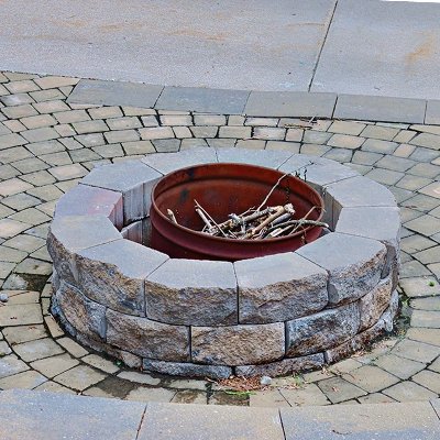 Wood butning firepit built out of stone blocks